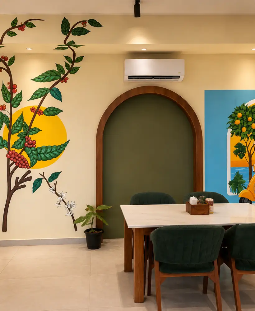 Arched alcove with framed botanical art and a velvet booth at Cafe 66