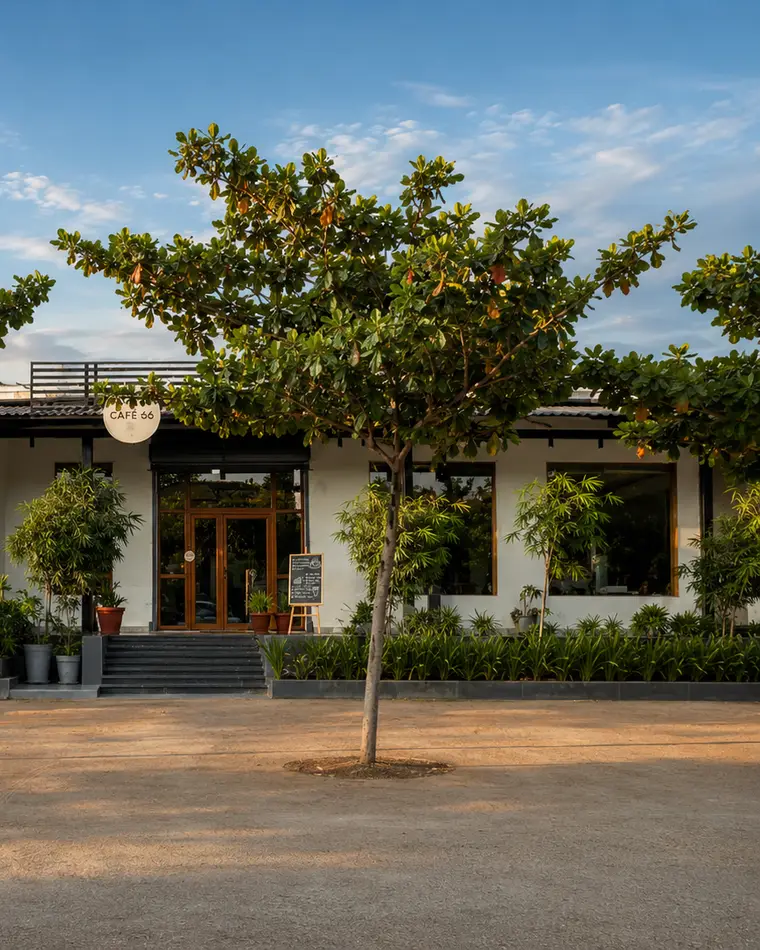 Café 66 set back from the NH44 with open parking and trees